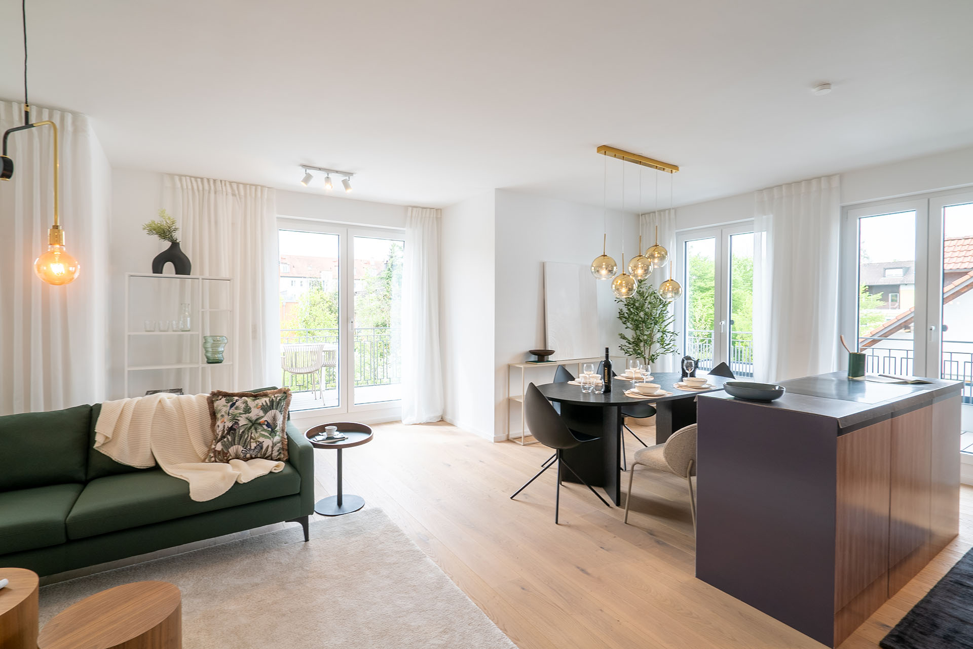Wohn- und Essbereich einer Neubau Wohnung von DOMINO Bau im Zimmermannweg 8 in München Denning