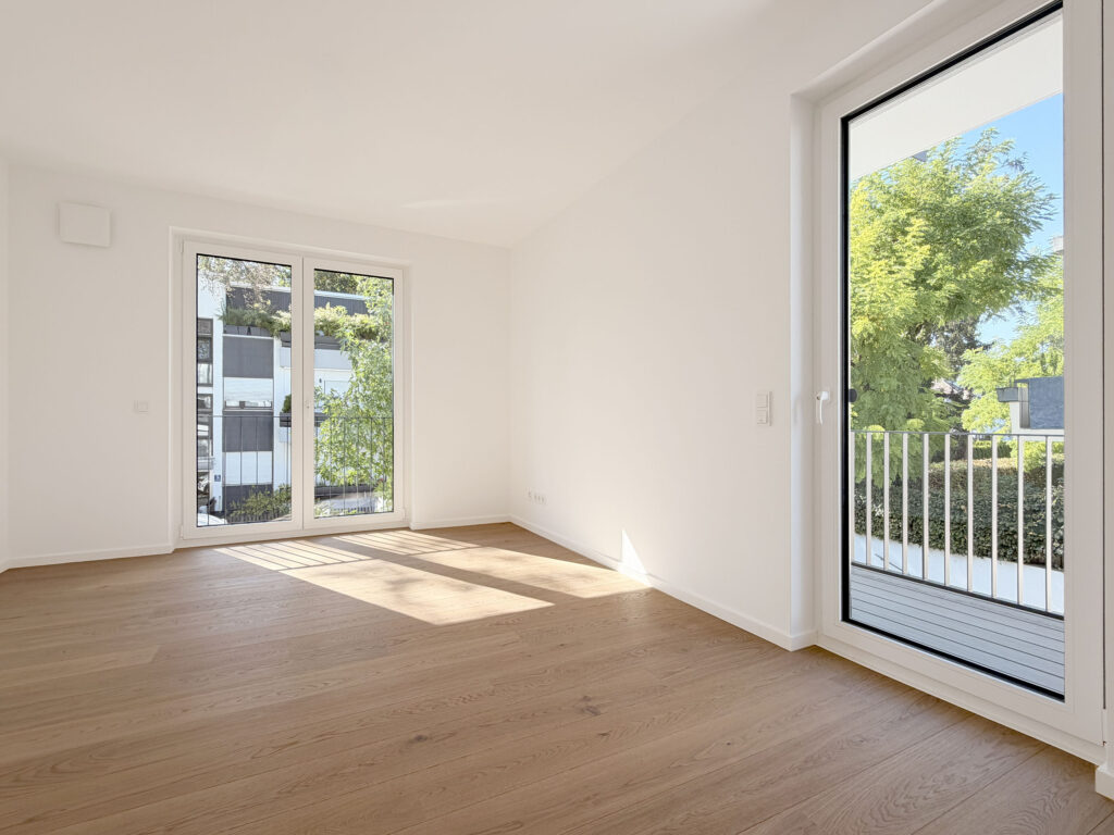 Foto eines Schlafzimmers der fertigstellten Wohnung in der Wastelbauerstraße 10 in Obermenzing von Domino Bau