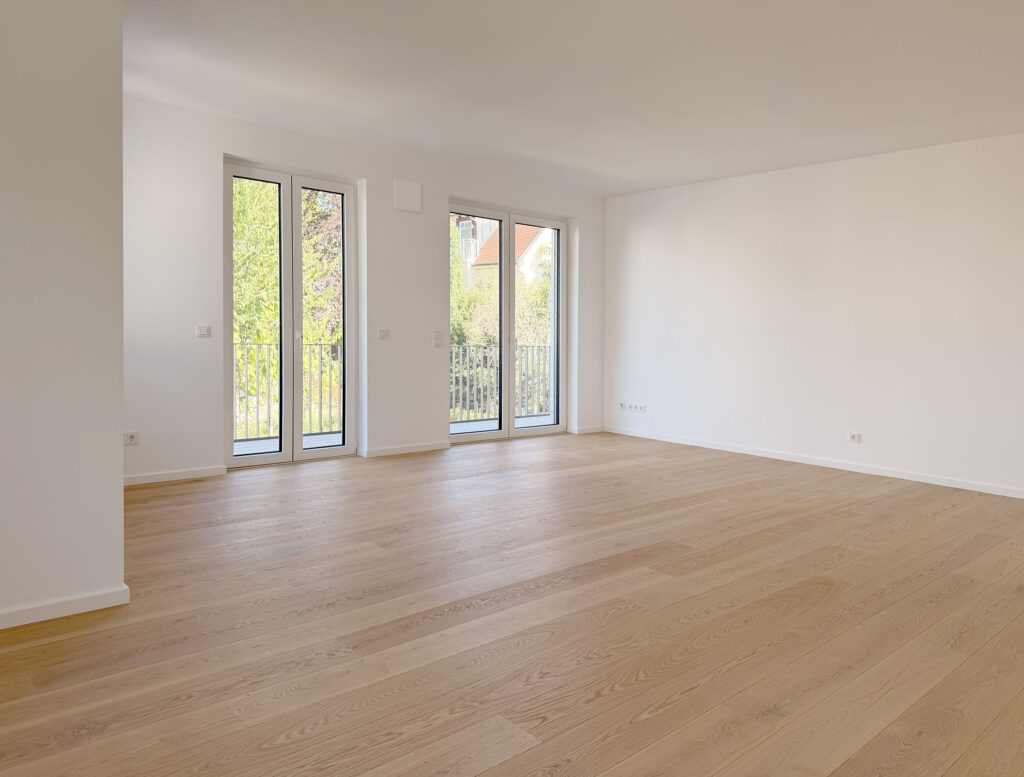 Foto eines Wohnzimmers der fertigstellten Wohnung in der Wastelbauerstraße 10 in Obermenzing von Domino Bau